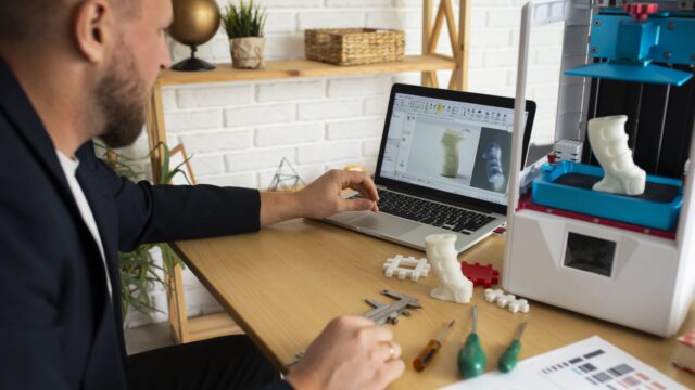 lifestyle-designer-using-3d-printer-min
