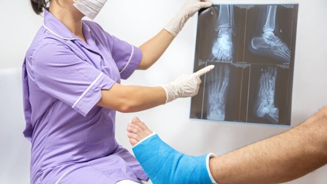 bone-fracture-foot-leg-male-patient-being-examined-by-woman-doctor-hospital-2